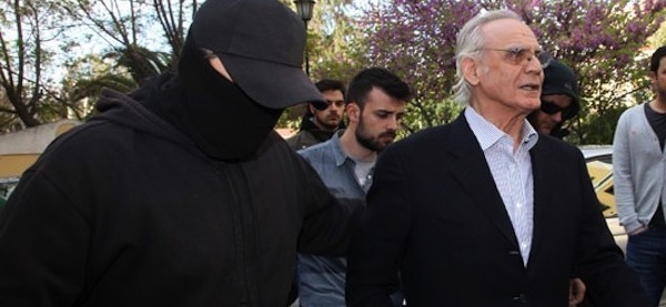 Former Defense Minister Akis Tsochatzopoulos being taken into custody