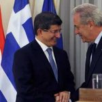 Greek Foreign Minister Dimitris Avramopoulos (R) with Turkish counterpart Ahmet Davutoglu 
