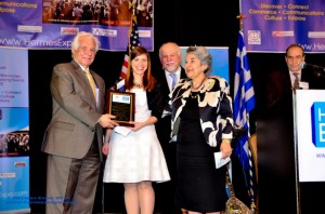 Dr. Despina Siolas presented with award by distinguished persons.