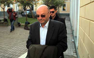 Dimitris Papachristos heads into court to testify in the defense scandal