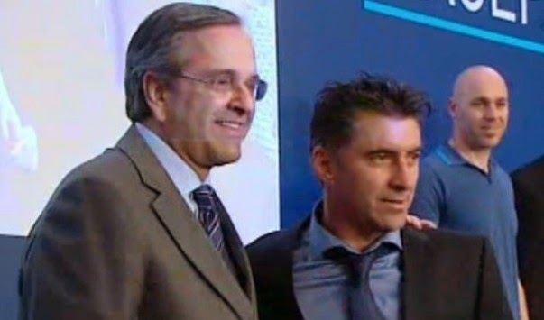 Greek PM Antonis Samaras (L) with former soccer star Theo Zagorakis, one of his candidates