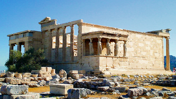 The Erechtheion Temple on the Acropolis hill in Athens -The Caryatid replicas are seen on the right side.