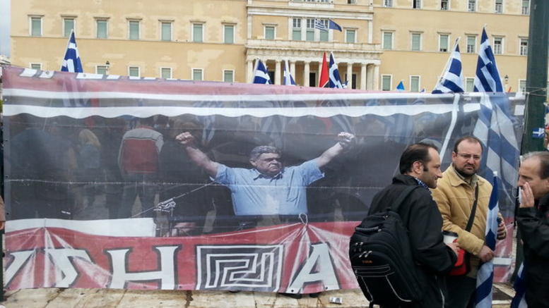 The image of jailed Golden Dawn leader Nikos Micholiakos outside Parliament