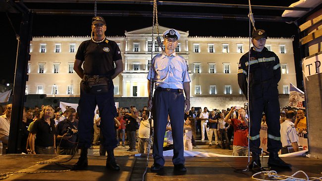 Greece's uniformed officers used a mock hanging in protest against their pay cuts