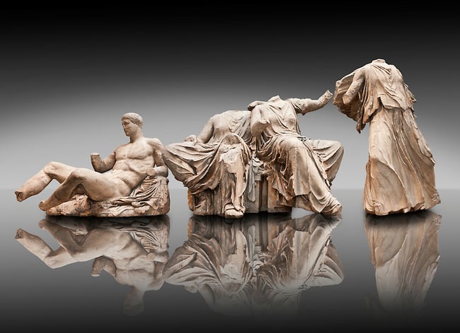 Figures from the East Pediment of the Parthenon, Acropolis Athens. From left to right cat no D Dionysos ,middle E & F Demeter & Persephone, left G Hebe. British Museum London Exhibit