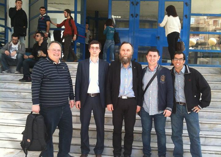 Nikos Kotzias, left, and Aleksandr Dugin, third from left, outside University of Piraeus