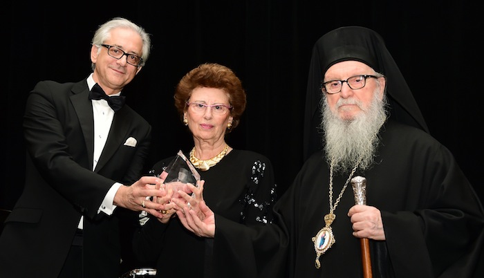 George S. Tsandikos, Leadership 100 Chairman, left, and Archbishop Demetrios present the Archbishop Iakovos Leadership 100 Award for Excellence to Angeliki (Lila) Lalaounis in honor of her late husband, Ilias I. Lalaounis. Photo Credit: GANP/Dimitrios Panagos 