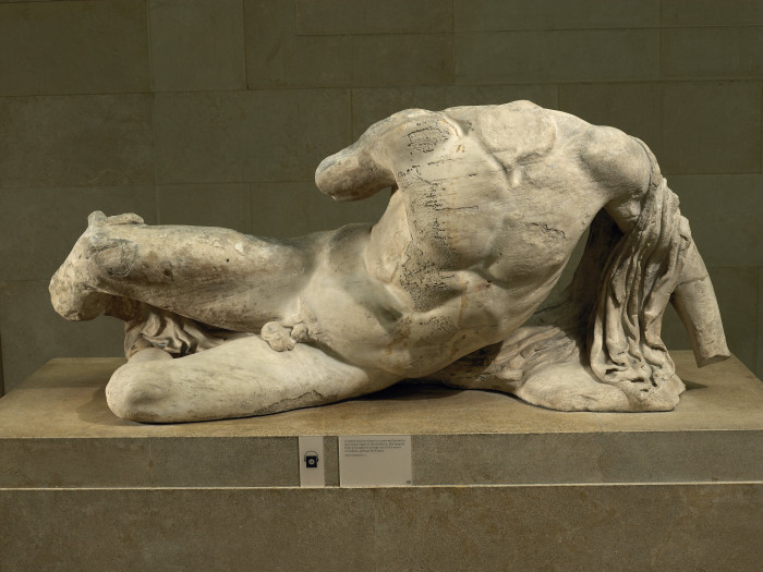 Ilissos. Marble statue of a river god from the West pediment of the Parthenon. Designed by Phidias, Athens, Greece, 438BC-432BC.  Height 81cm x 189cm.  © The Trustees of the British Museum. 
