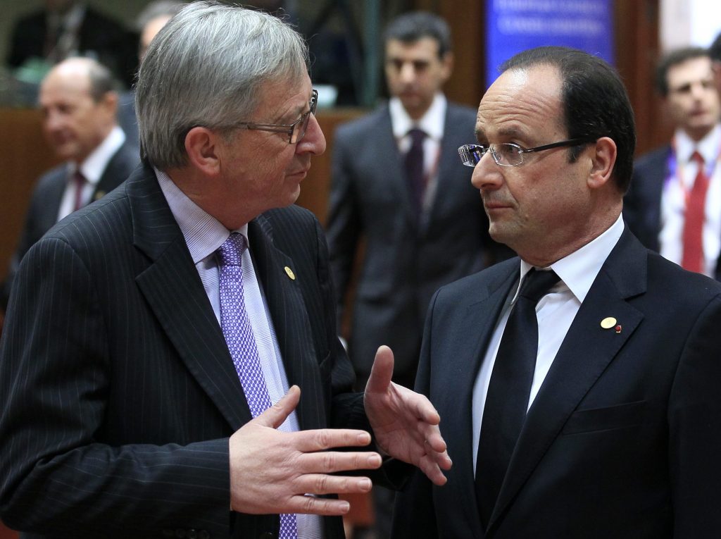 Luxembourg's Prime Minister Jean-Claude Juncker and France's President Francois Hollande attend a European Union leaders summit in Brussels