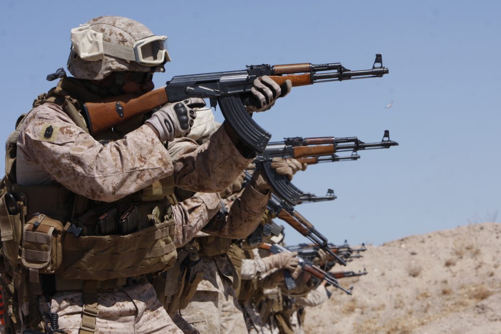 Marines training with the Combat CenterÕs Advisor Training Group fire AK-47s during a Combat Marksmanship Program shoot at Range 113A July 14. The Marines are bound for Operation Enduring Freedom this fall.