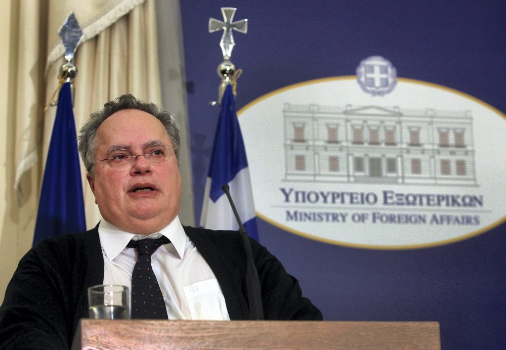 epa04589362 Newly appointed Greek Foreign Minister Nikos Kotzias looks on during the handover ceremony at the Foreign Ministry in Athens, Greece, 27 January 2015. The members of the new Greek government were sworn in at evening in the presence of President of the Republic Karolos Papoulias and Prime Minister Alexis Tsipras. It is the first government in the Greek history lead by a leftist Premier.-=  EPA/SIMELA PANTZARTZI