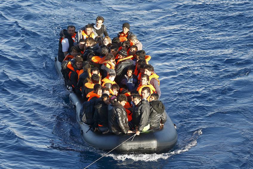 A dinghy full of refugees and migrants is towed by a Turkish Coast Guard fast rigid-hulled inflatable boat (not seen) on the Turkish territorial waters of the North Aegean Sea, following a failed attempt of crossing to the Greek island of Chios, off the shores of Izmir, Turkey, February 28, 2016. Picture taken February 28, 2016. REUTERS/Umit Bektas
