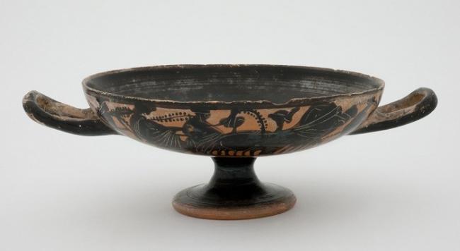 Attic black-figure kylix with Dionysiac procession on sides and satyr in tondo c. 500 BCE. The University of Melbourne Art Collection