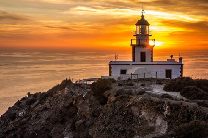 Sunset at the Lighthouse of Santorini.