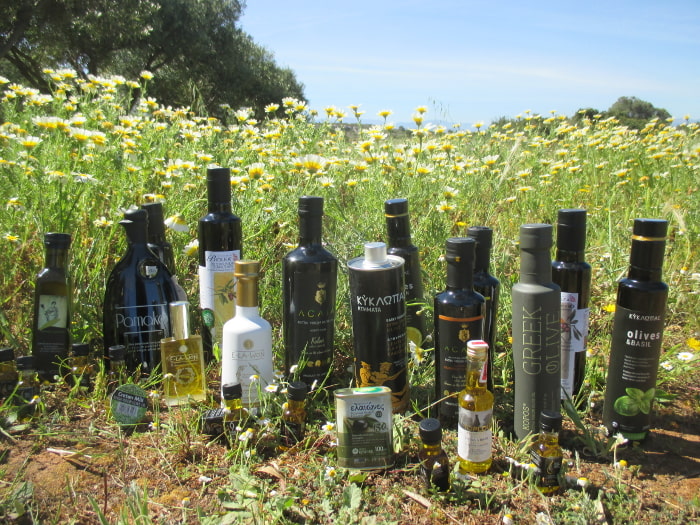 Bottles of Greek Olive Oil in a Field of Wild Daisies