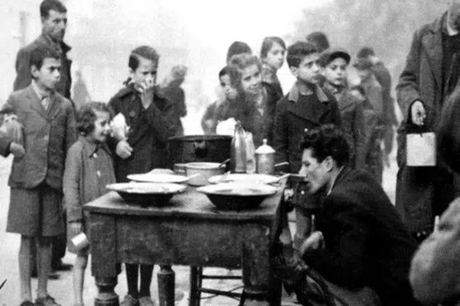 Children waiting to be served in a soup kitchen in Athens