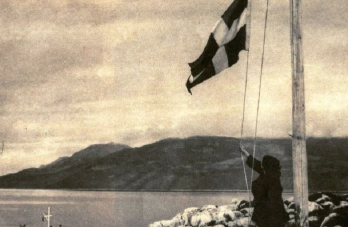 Lady of Ro raising the Greek flag
