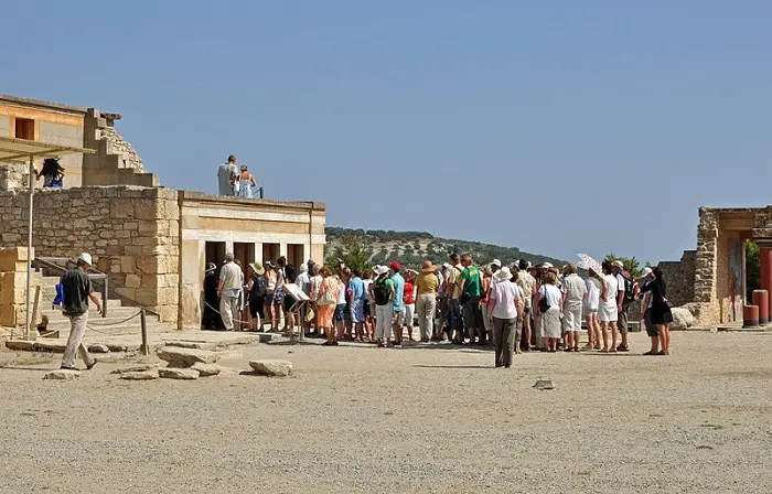 Crowd of tourists at the Minoan Palace of Knossos, Crete.