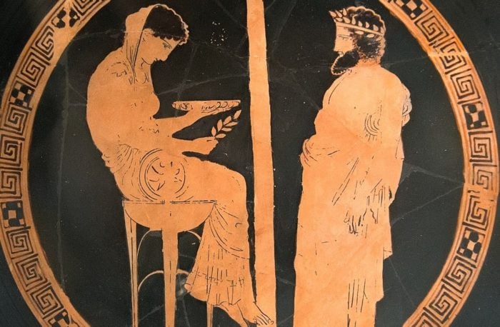 a depiction of ancient Greek King Aigeus in front of the oracle of Delphi, Pythia. 