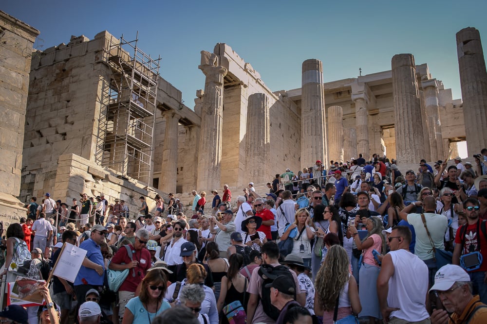 tourists flood the acropolis of athens