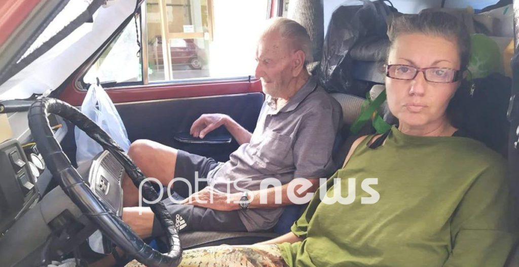 Homeless woman with elderly man in Amaliada