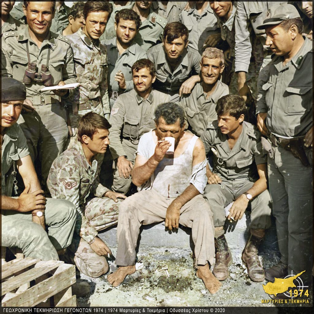 Cypriot captive surrounded by Turkish soldiers