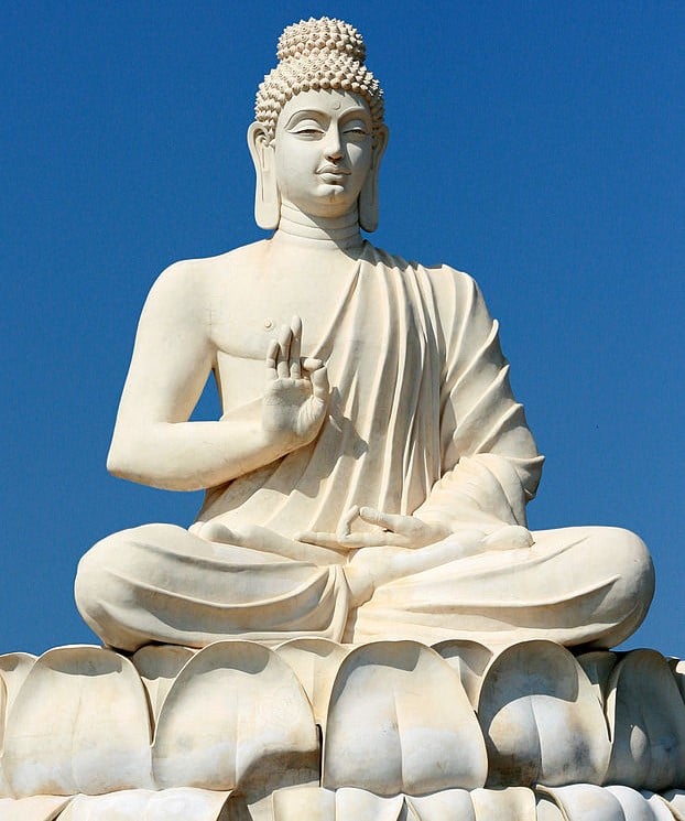 A statue depicting Buddha performing the vitarka mudra.
