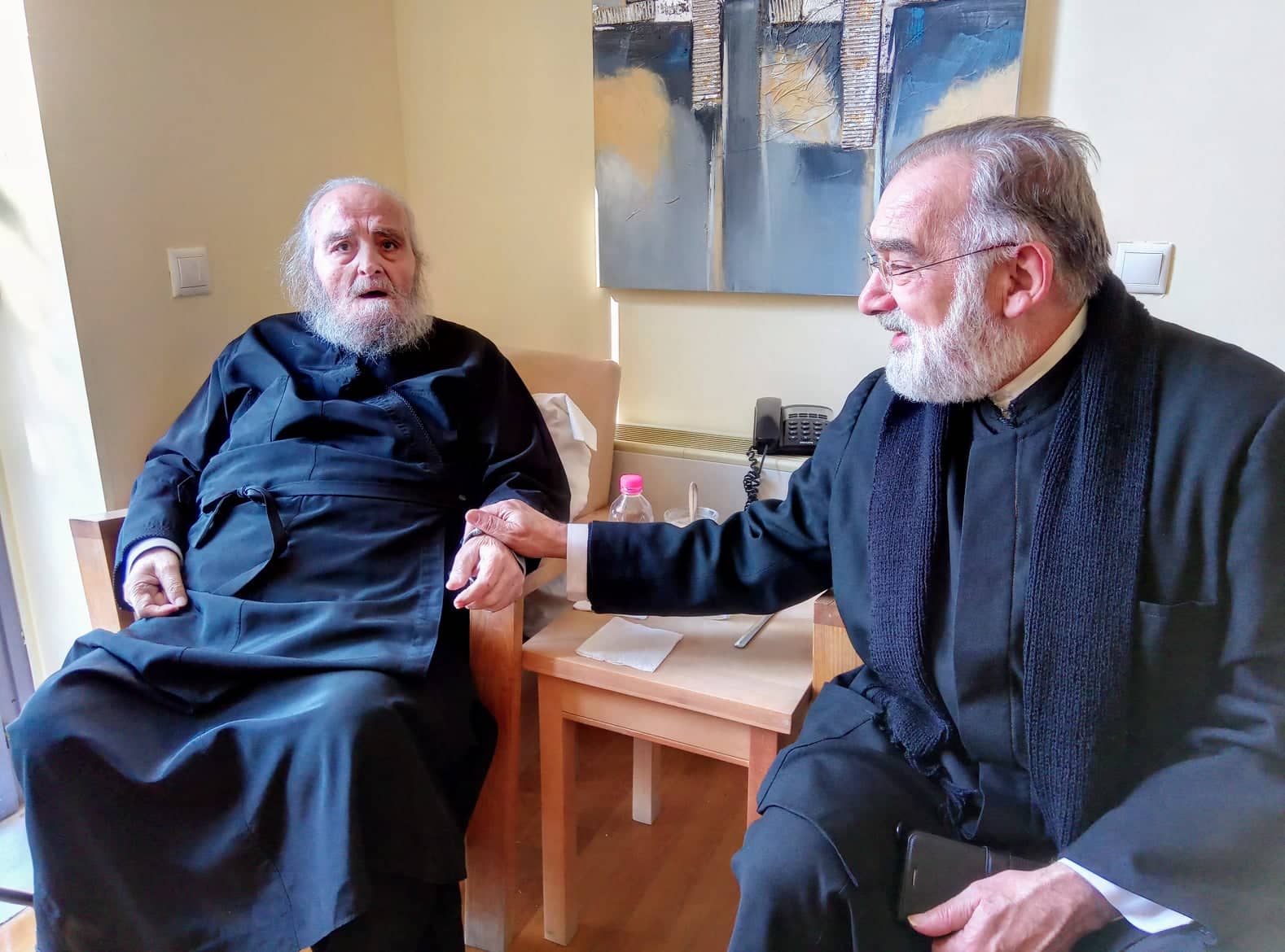 Father Timotheus Iliakis with former patriarch Irineos I at the hospital