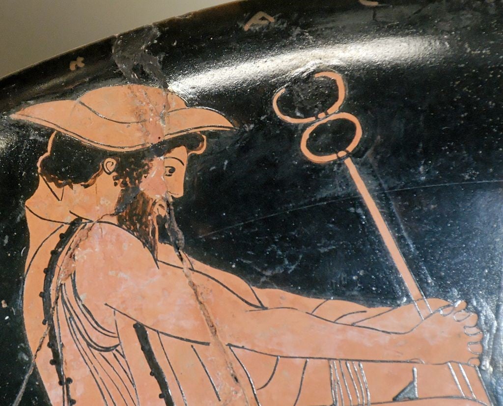 Greek god Hermes wearing petasos hat with caduceus