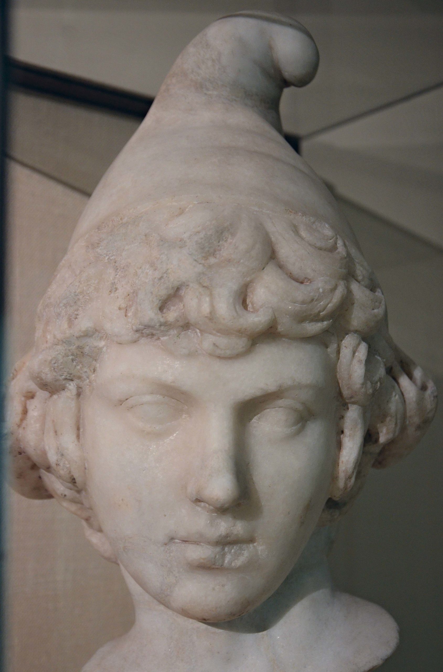 Bust of Attis as a child wearing the Phrygian cap, Parian marble, 2nd century AD, probably during the reign of Hadrian: the portrait bears ressemblance to those of Antinous