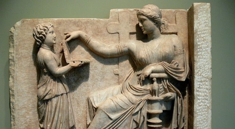 Ancient Greek Statue of Woman Using “Laptop” Sparks Conspiracy Theories