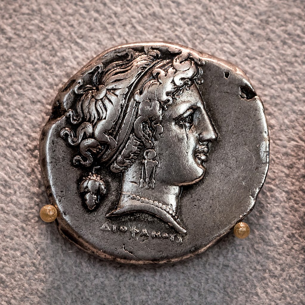 Ancient coin from Naples depicting head of Parthenope, mythical siren