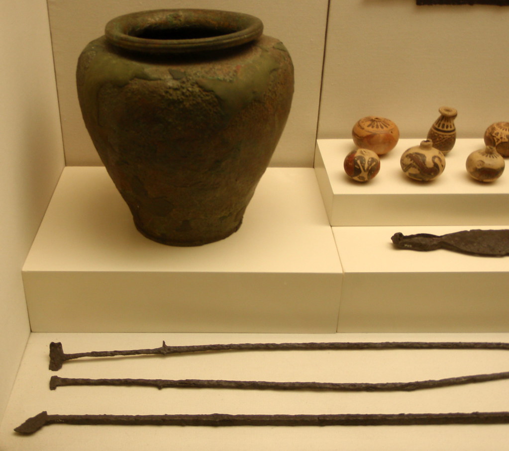 Ancient bronze skewers and vase, with small painted ceramic amphora 
