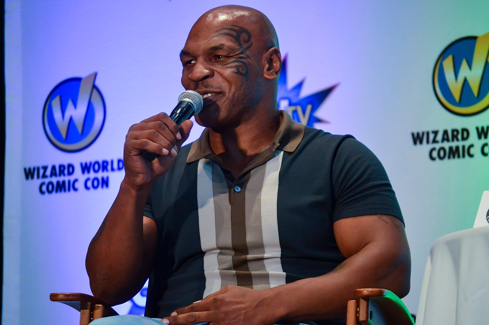 Mike Tyson speaking with a microphone 