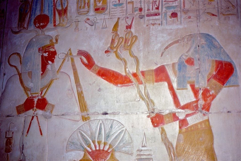 Thoth (aka Hermes Trismegistus), author of the Emerald Tablet, gives the sign of life to Seti I, 