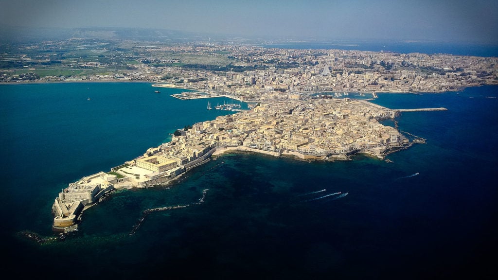 the ancient Greek city of Syracuse and the island of Ortigia in modern times