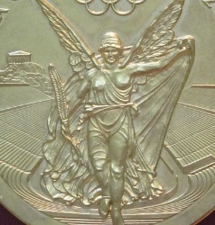 Picture of Nike, Greek goddess of victory, alongside the Parthenon on the Acropolis, on an Olympic medal.