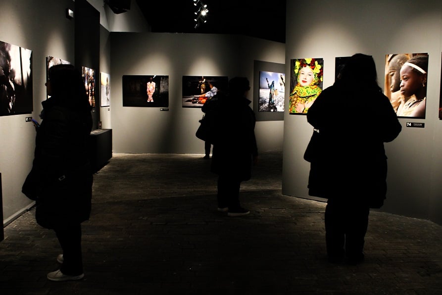 Visitors at Terra Incognita photo exhibition at Technopolis, Athens. 