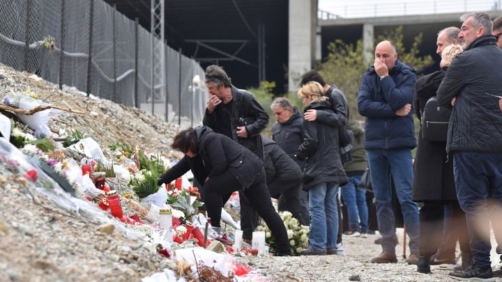 Relatives and friends of the Greek railway disaster lay flowers at the site