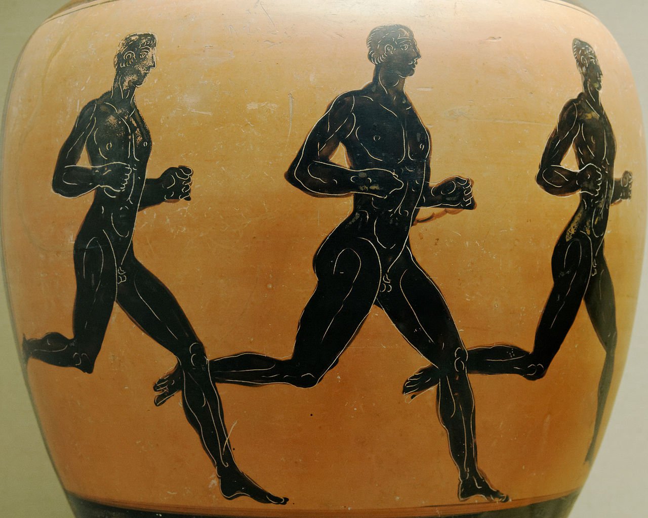 An pottery depicting three runners at the Olympic Games.