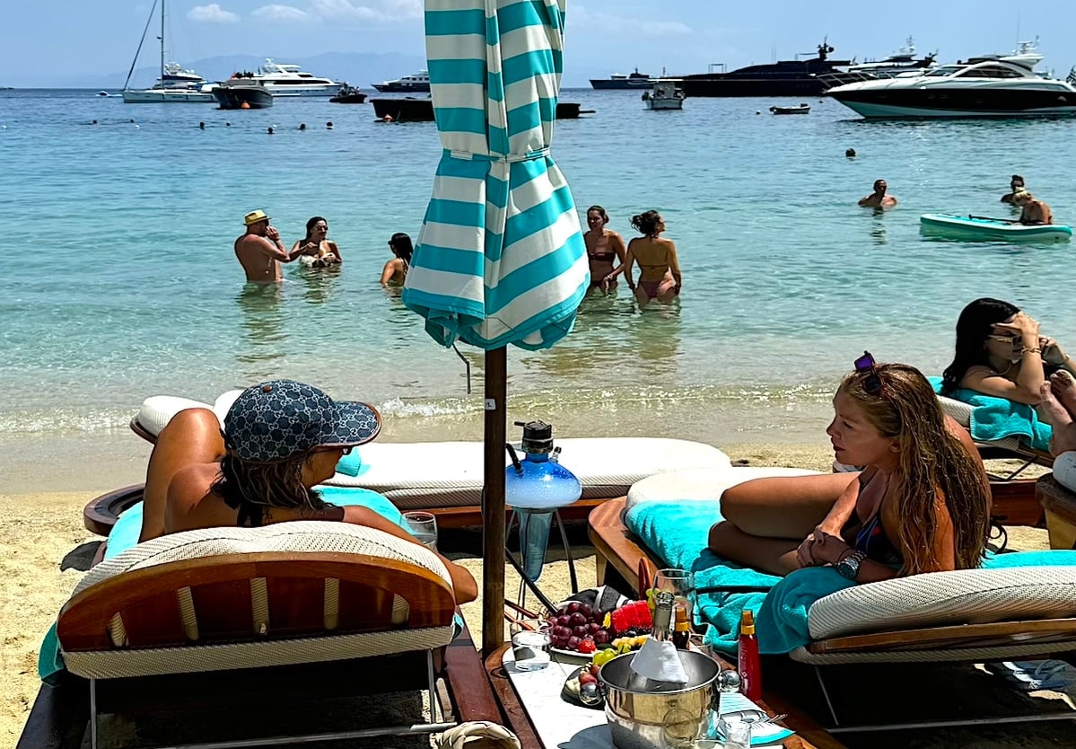 Greeks at the beach. Nearly half of Greeks say they will be staying at home this summer rather than going off on vacation. 