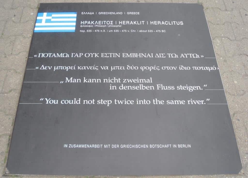 Plaque embedded in a stone walkway on the Path of Visionaries in Berlin, displaying the engraved name and quote of Heraclitus, designed to honor him.