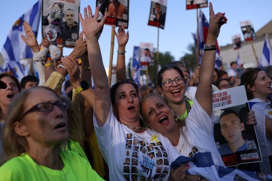 Israelis celebrate prior to the scheduled release of hostages