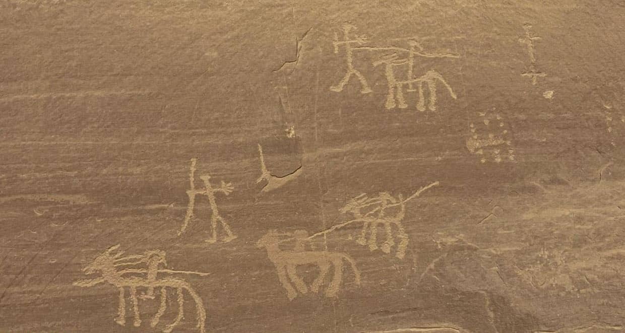 Engraved figures on a stone surface