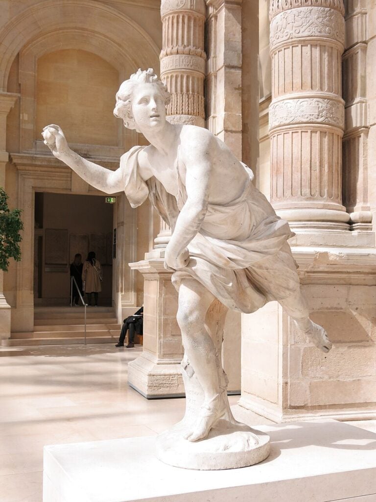 Marble statue of Hippomenes by Guillaume Coustou. Louvre Museum in Paris, France. 