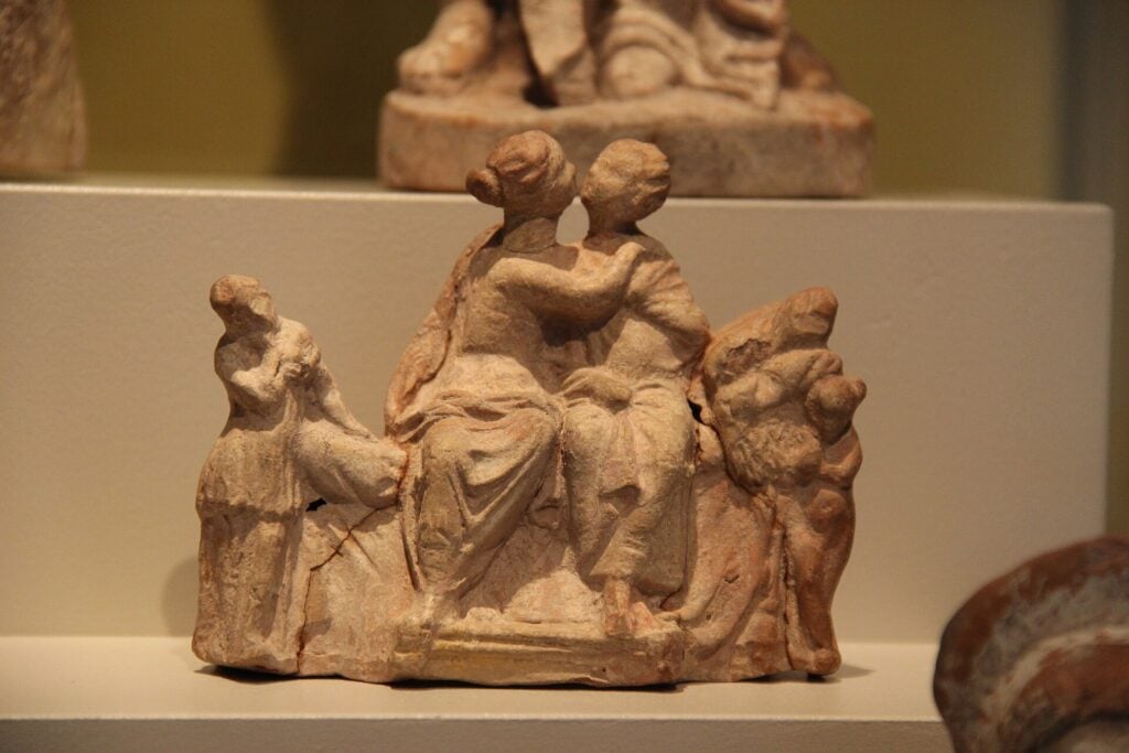 Photo of terracotta sculpture of two lovers from the Hellenistic or Roman period exhibited at the Altes Museum, Berlin, Germany. The Ancient Greek poet Archias was famous for his love epigrams.