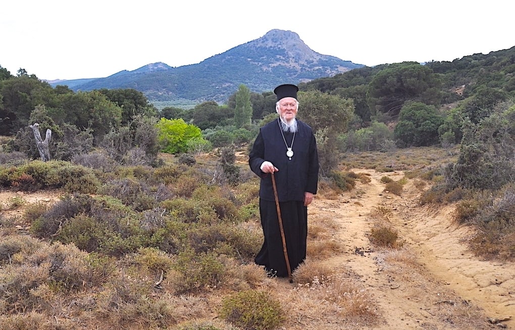 Ecumenical Patriarch Bartholomew on undeveloped land during a visit to Imbros, his native island, a symbolic center for the Greeks of Imbros and their efforts to preserve their heritage. 