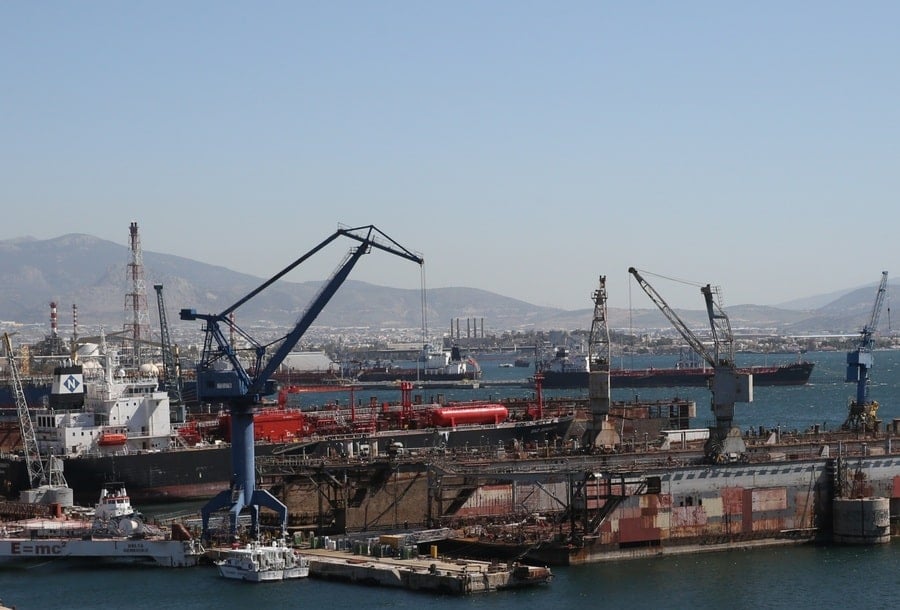 Ships, cranes, and dry dock infrastructure at Elefsina Shipyards in Greece.