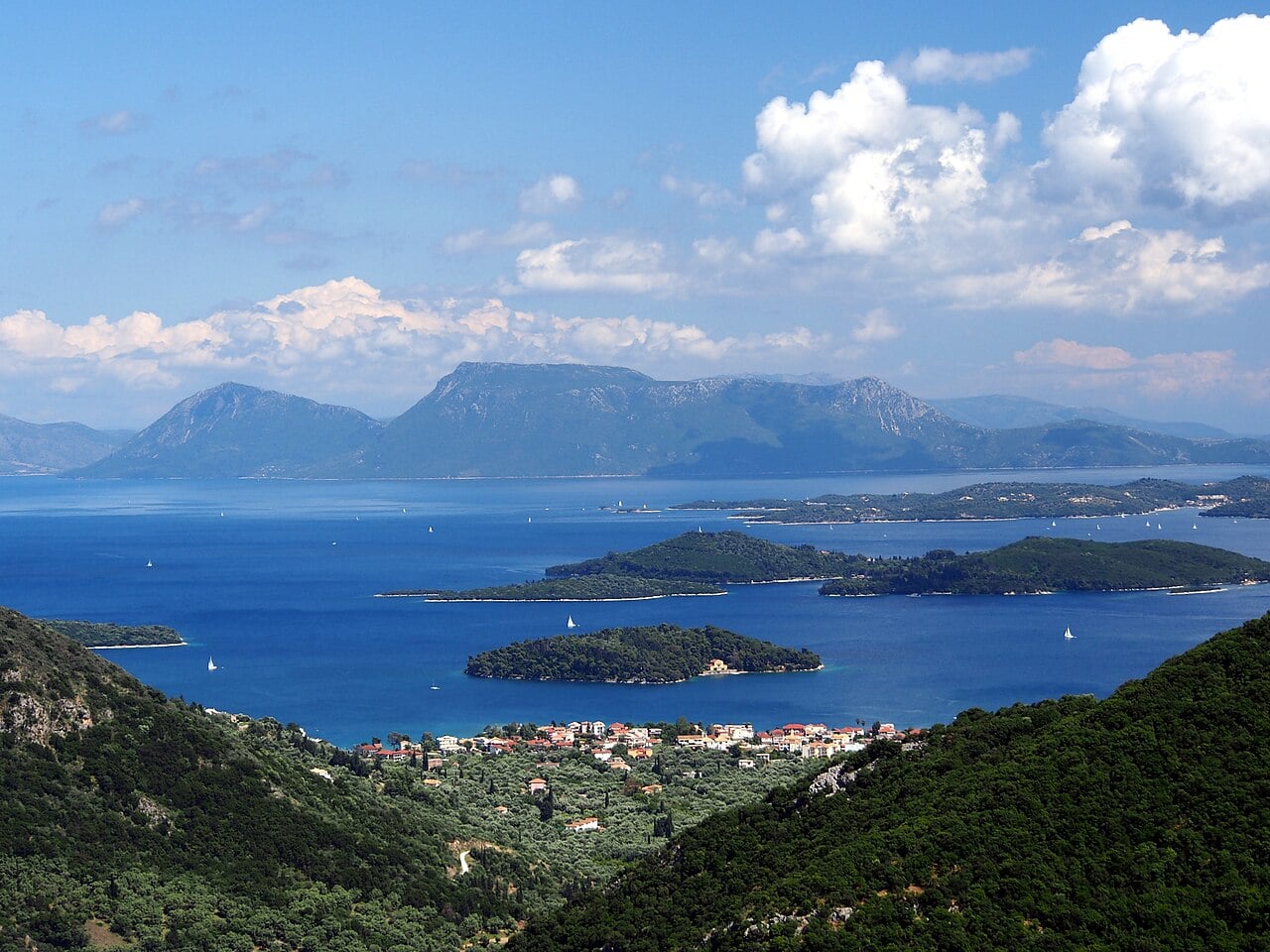 Lefkada, Greece, with Nydri and nearby Ionian islands seen from above. The Greek islands of Lefkada and Folegandros have captured the interest of GenZ folks, according to Airbnb.