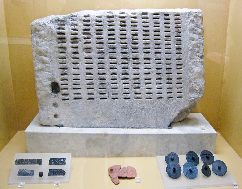 Kleroterion made of marble with identification tickets (pinakia) that were inserted in the slots to indicate eligible jurors in a system of democracy. Exhibited at the Ancient Agora Museum in Athens.